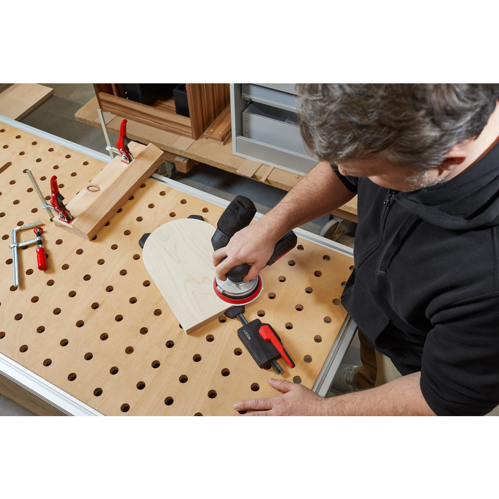Horizontal pull-down clamp for multifunctional tables